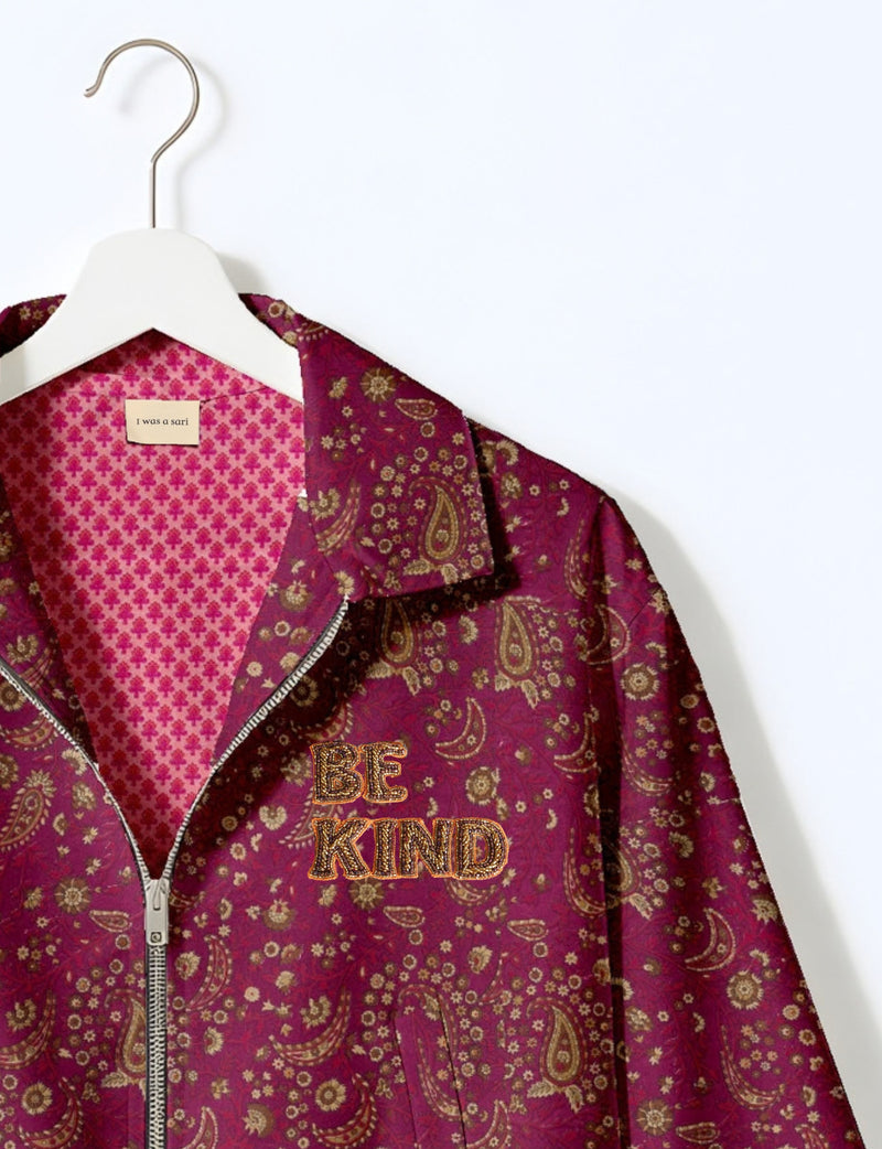 BE KIND Bomber jacket made from upcycled sari fabric with handcrafted Aari embroidery by female artisans.