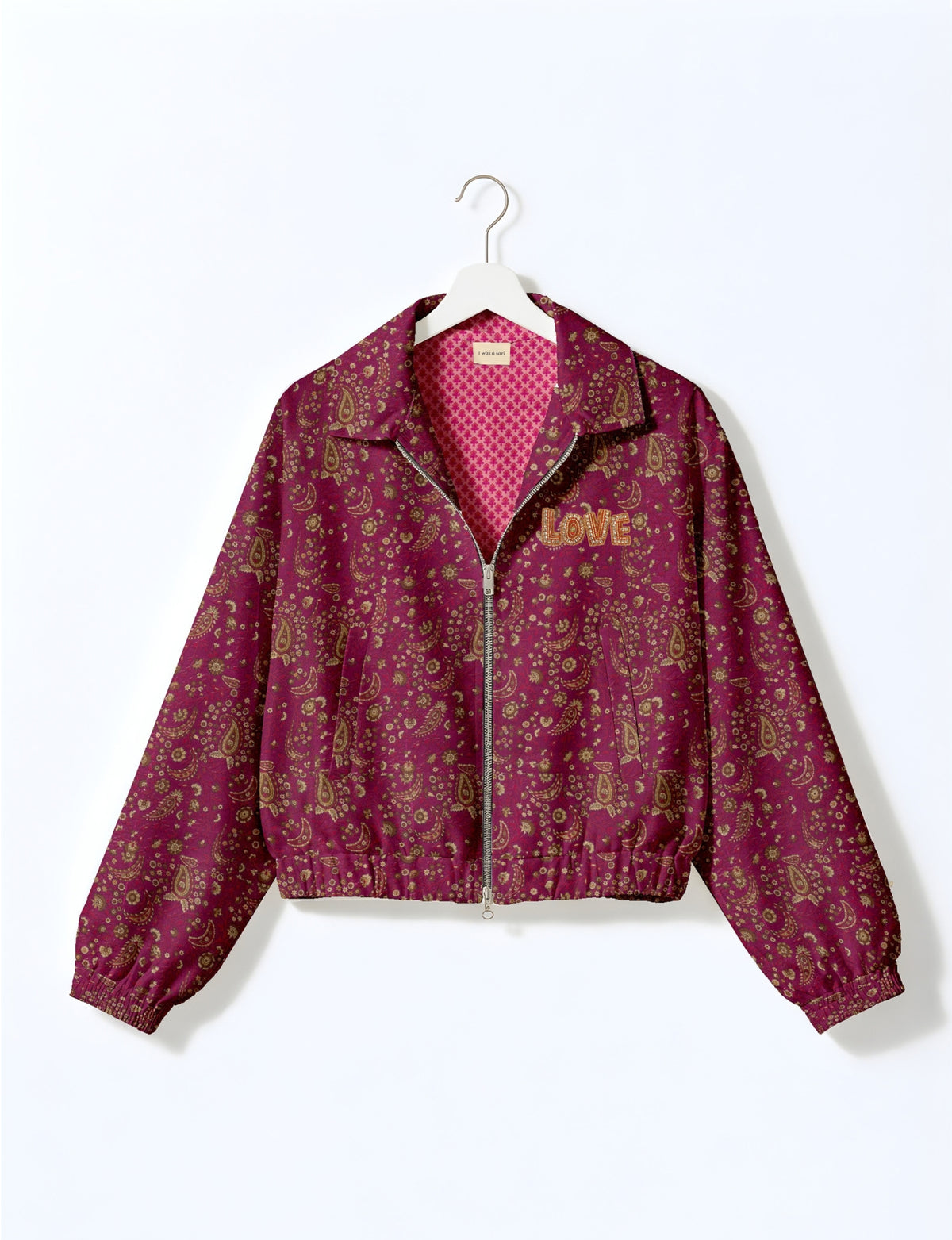 Love Bomber Jacket made from recycled fabric, featuring hand-stitched Aari embroidery. A unique piece of zero-waste clothing, part of the circular fashion movement. Designed with upcycled materials for a stylish yet environmentally friendly clothing choice.