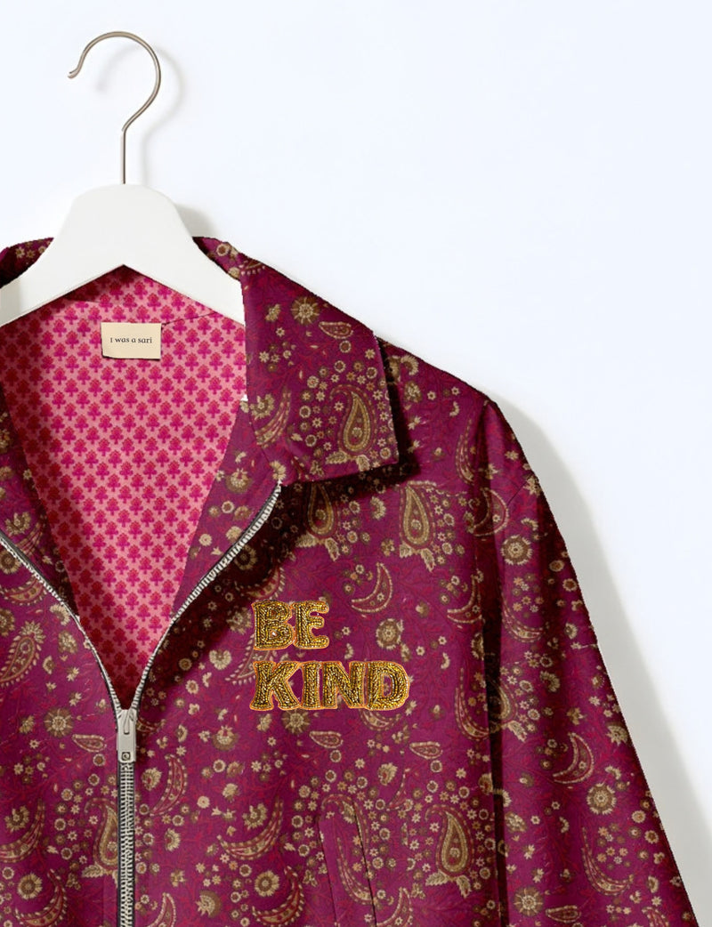 BE KIND Bomber jacket made from upcycled sari fabric with handcrafted Aari embroidery by female artisans.