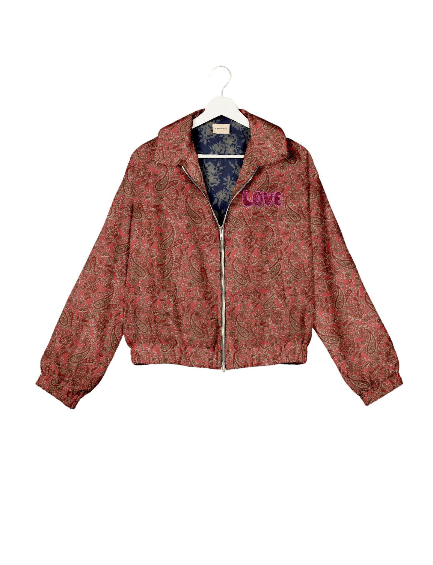 Love Bomber Jacket made from recycled fabric, featuring hand-stitched Aari embroidery. A unique piece of zero-waste clothing, part of the circular fashion movement. Designed with upcycled materials for a stylish yet environmentally friendly clothing choice.