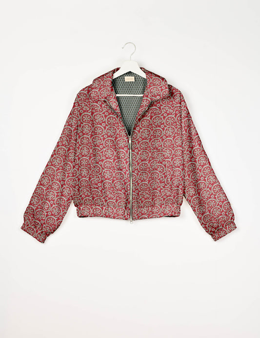 Upcycled Bomber Jacket made from recycled sari materials, featuring a cute cropped shape, elasticated hem and cuffs, and contrast sari print lining. Sustainable apparel promoting eco-friendly fashion and ethical clothing.