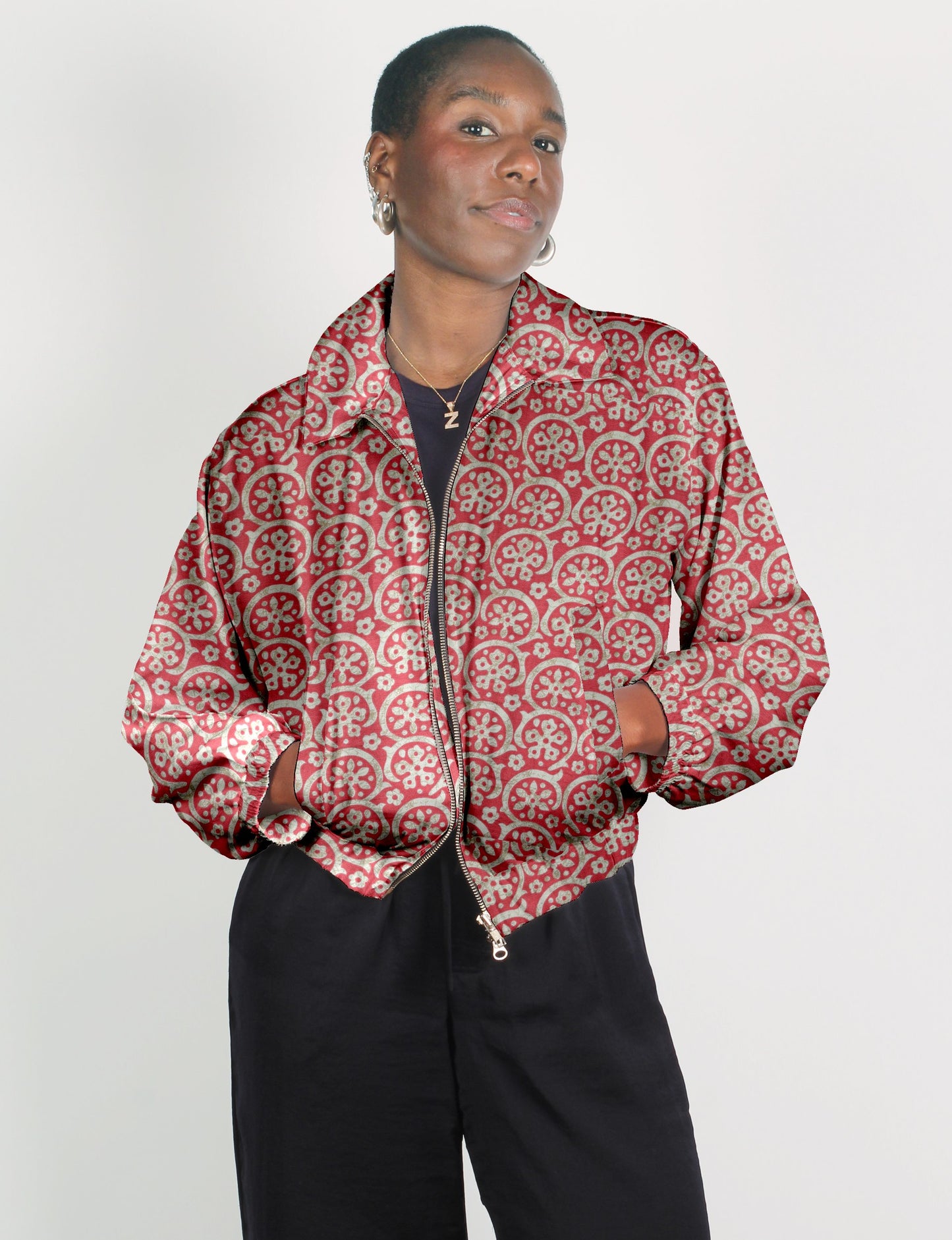Upcycled Bomber Jacket made from recycled sari materials, featuring a cute cropped shape, elasticated hem and cuffs, and contrast sari print lining. Sustainable apparel promoting eco-friendly fashion and ethical clothing.