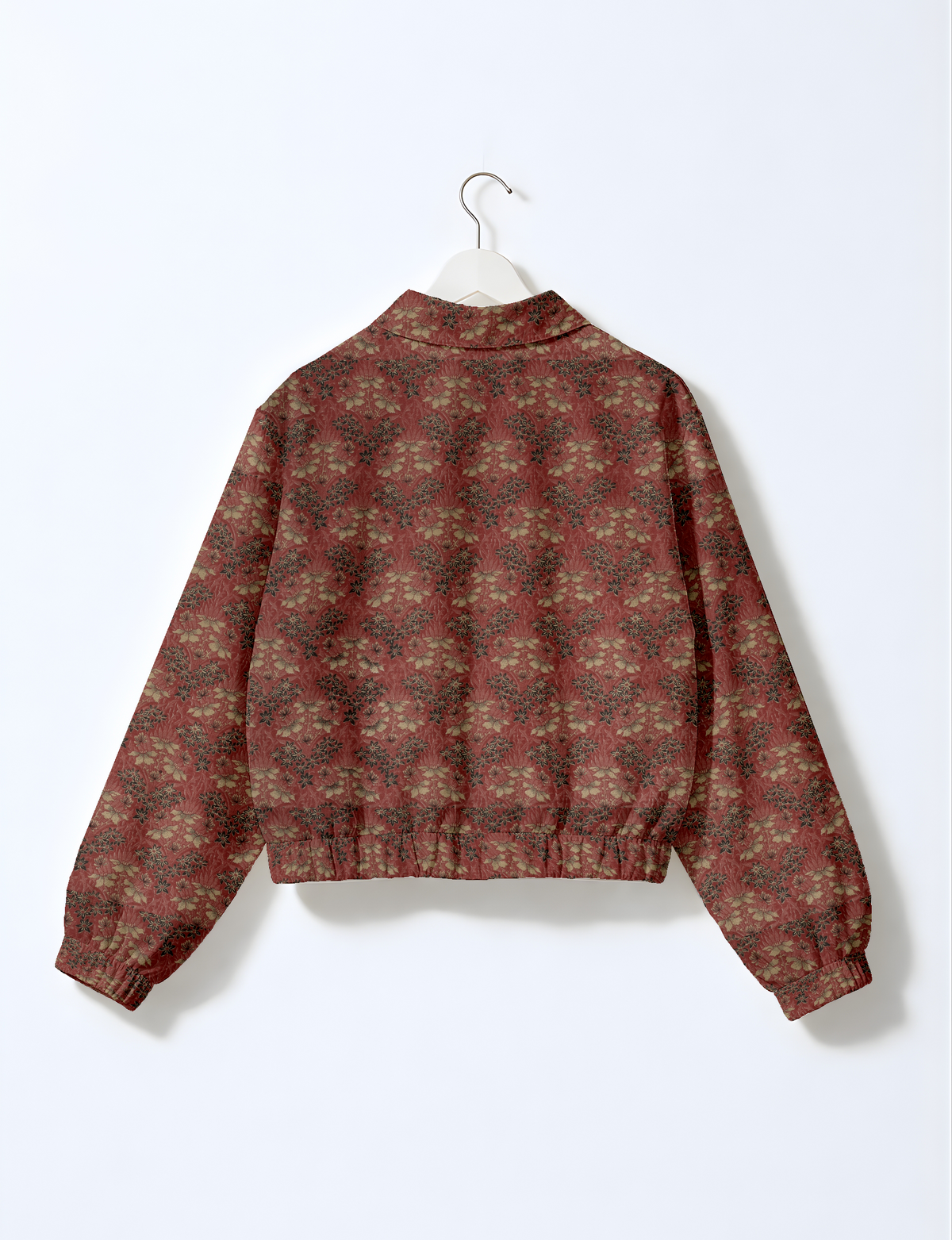Upcycled Bomber Jacket made from recycled sari materials, featuring a cute cropped shape, elasticated hem and cuffs, and contrast sari print lining. Sustainable apparel promoting eco-friendly fashion and ethical clothing.