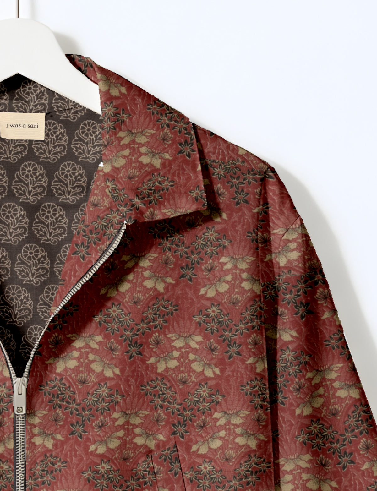 Upcycled Bomber Jacket made from recycled sari materials, featuring a cute cropped shape, elasticated hem and cuffs, and contrast sari print lining. Sustainable apparel promoting eco-friendly fashion and ethical clothing.