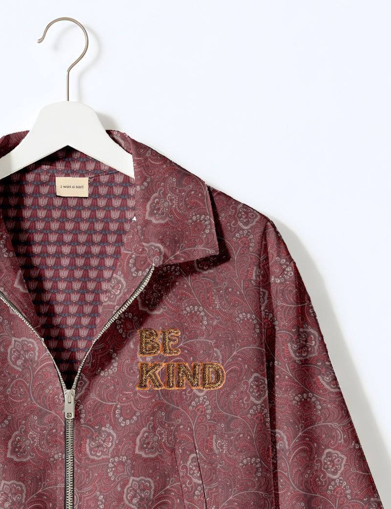 BE KIND Bomber jacket made from upcycled sari fabric with handcrafted Aari embroidery by female artisans.