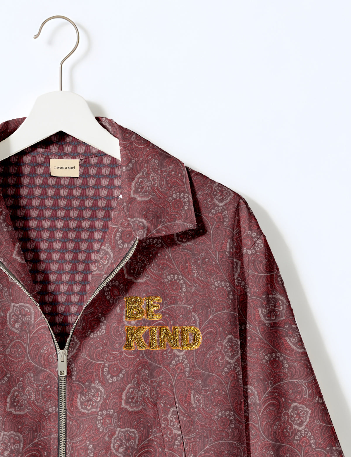 BE KIND Bomber jacket made from upcycled sari fabric with handcrafted Aari embroidery by female artisans.