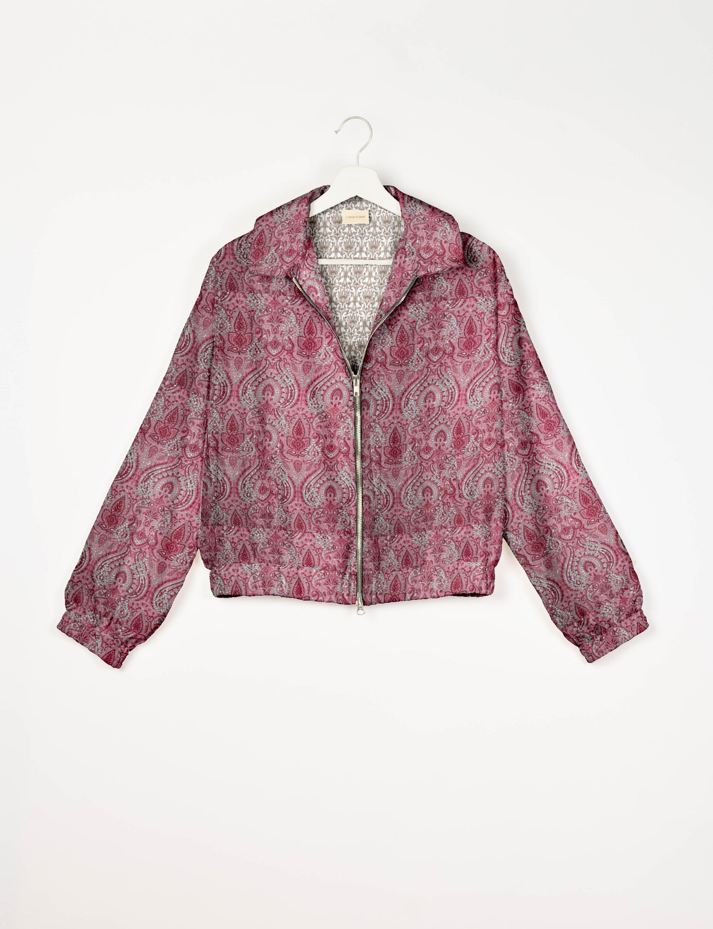 Upcycled Bomber Jacket made from recycled sari materials, featuring a cute cropped shape, elasticated hem and cuffs, and contrast sari print lining. Sustainable apparel promoting eco-friendly fashion and ethical clothing.