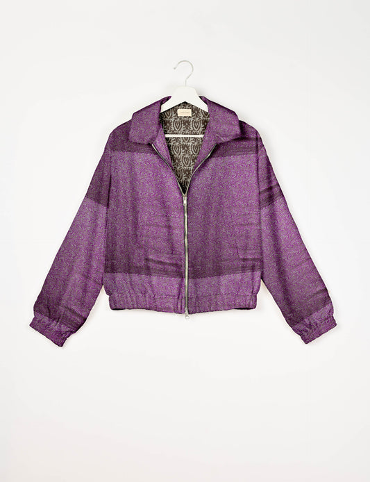 Upcycled Bomber Jacket made from recycled sari materials, featuring a cute cropped shape, elasticated hem and cuffs, and contrast sari print lining. Sustainable apparel promoting eco-friendly fashion and ethical clothing.