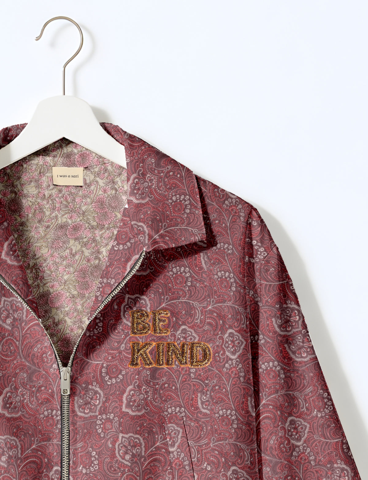 BE KIND Bomber jacket made from upcycled sari fabric with handcrafted Aari embroidery by female artisans.