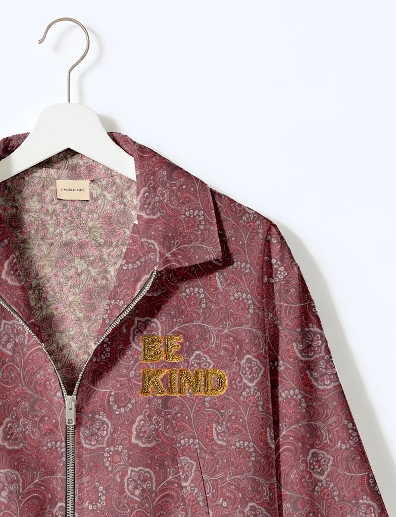 BE KIND Bomber jacket made from upcycled sari fabric with handcrafted Aari embroidery by female artisans.