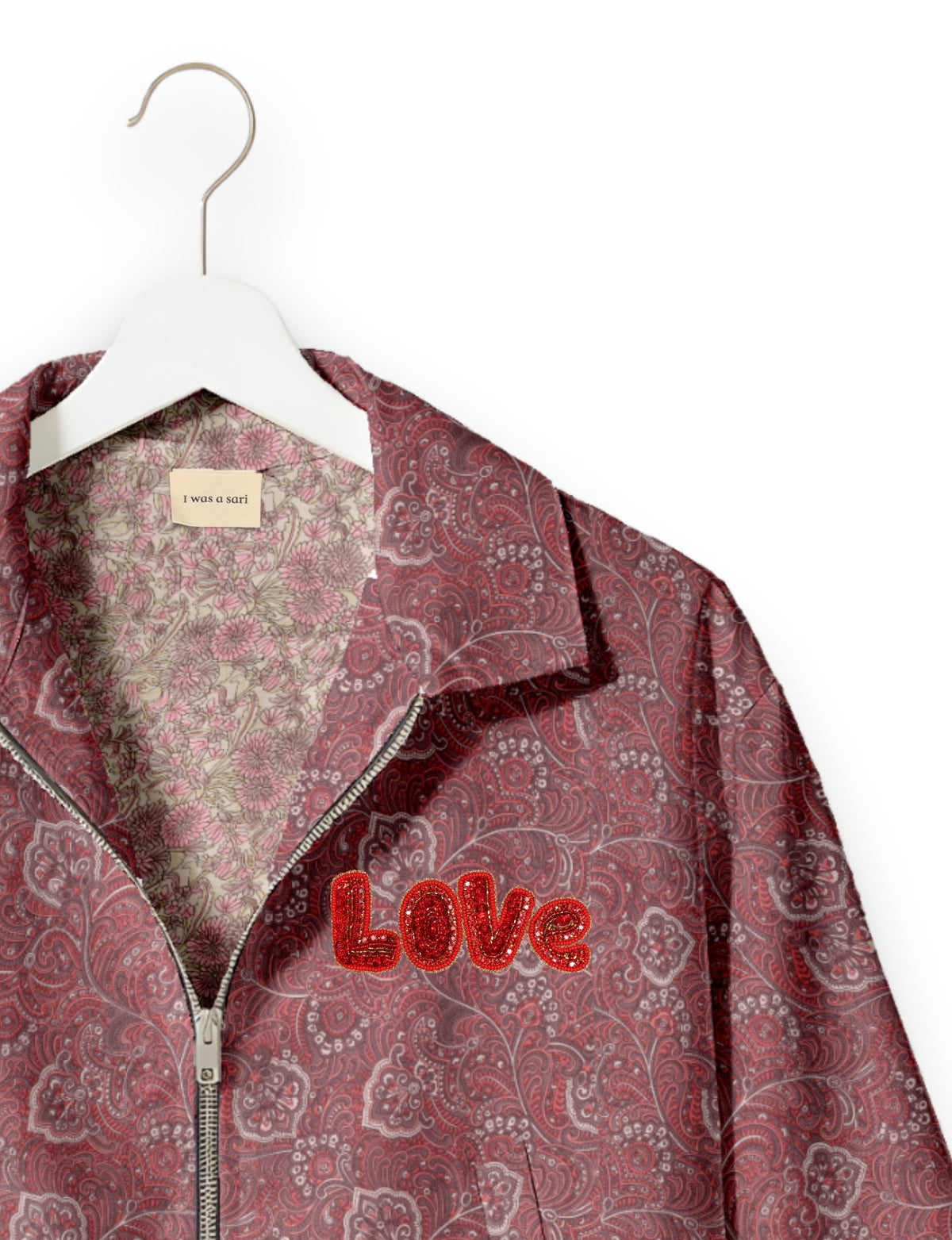 Love Bomber Jacket made from recycled fabric, featuring hand-stitched Aari embroidery. A unique piece of zero-waste clothing, part of the circular fashion movement. Designed with upcycled materials for a stylish yet environmentally friendly clothing choice.