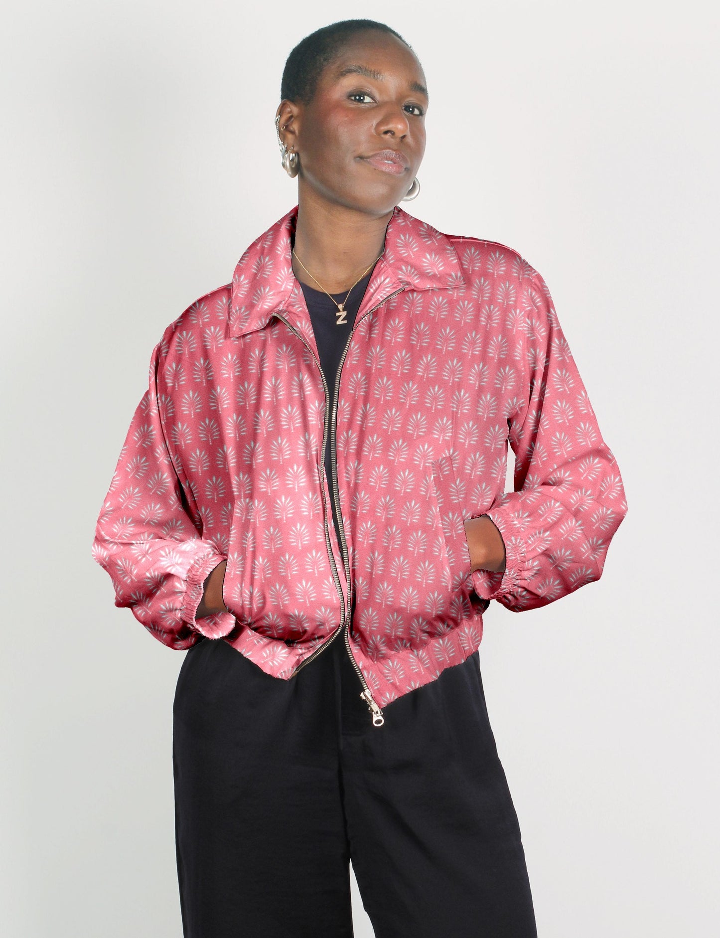 Upcycled Bomber Jacket made from recycled sari materials, featuring a cute cropped shape, elasticated hem and cuffs, and contrast sari print lining. Sustainable apparel promoting eco-friendly fashion and ethical clothing.