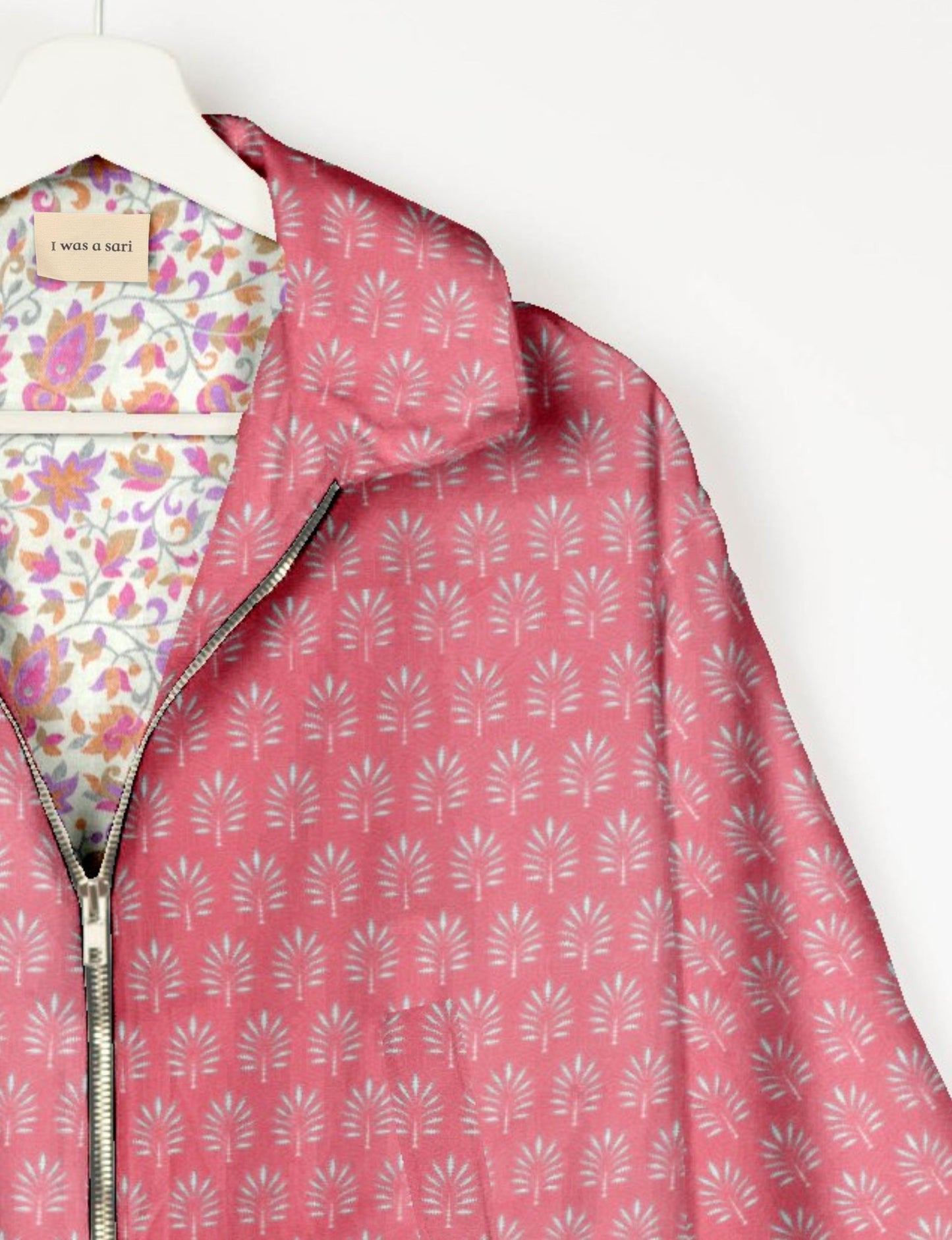 Upcycled Bomber Jacket made from recycled sari materials, featuring a cute cropped shape, elasticated hem and cuffs, and contrast sari print lining. Sustainable apparel promoting eco-friendly fashion and ethical clothing.