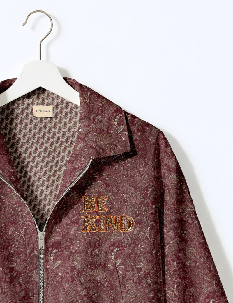 BE KIND Bomber jacket made from upcycled sari fabric with handcrafted Aari embroidery by female artisans.