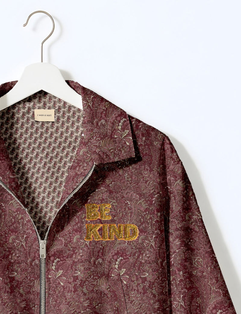 BE KIND Bomber jacket made from upcycled sari fabric with handcrafted Aari embroidery by female artisans.