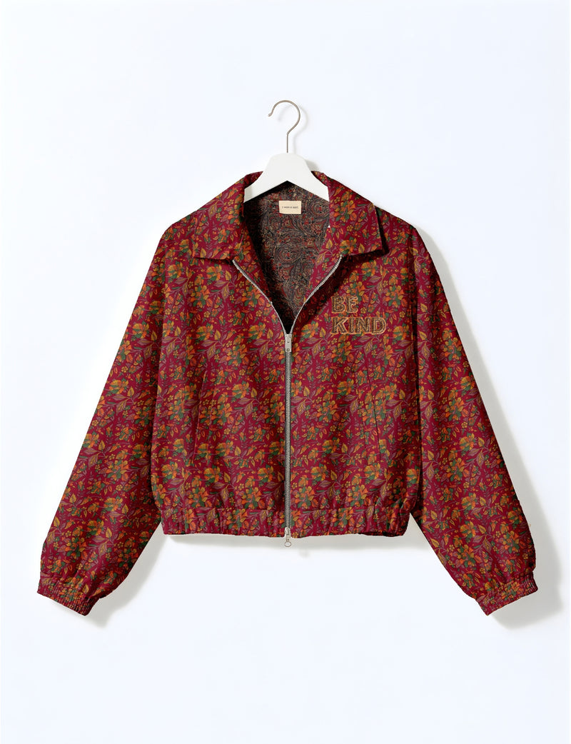 BE KIND Bomber jacket made from upcycled sari fabric with handcrafted Aari embroidery by female artisans.