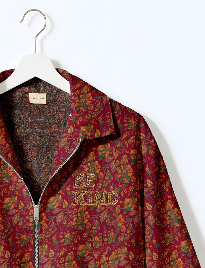 BE KIND Bomber jacket made from upcycled sari fabric with handcrafted Aari embroidery by female artisans.