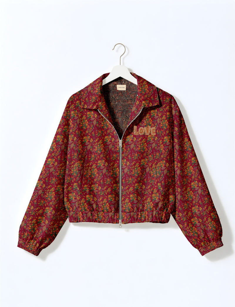Love Bomber Jacket made from recycled fabric, featuring hand-stitched Aari embroidery. A unique piece of zero-waste clothing, part of the circular fashion movement. Designed with upcycled materials for a stylish yet environmentally friendly clothing choice.