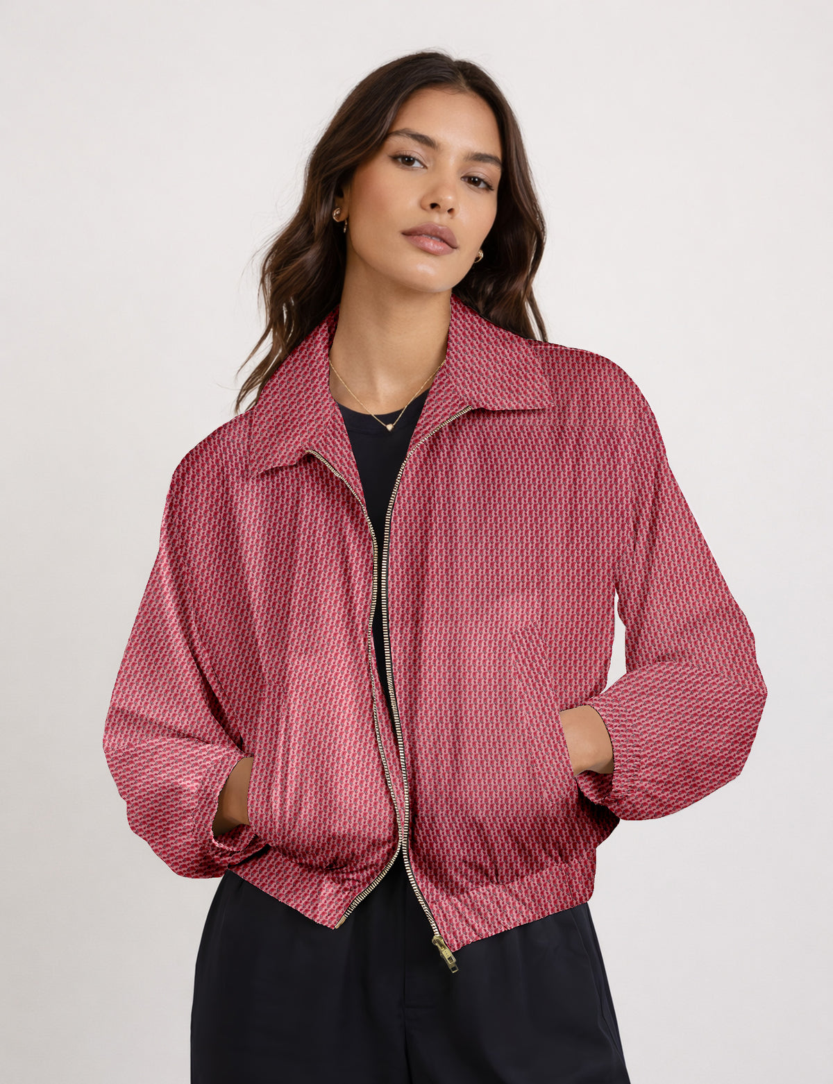 Woman wearing a yellow floral bomber jacket with front zipper, elastic cuffs, and side pockets, shown from front view