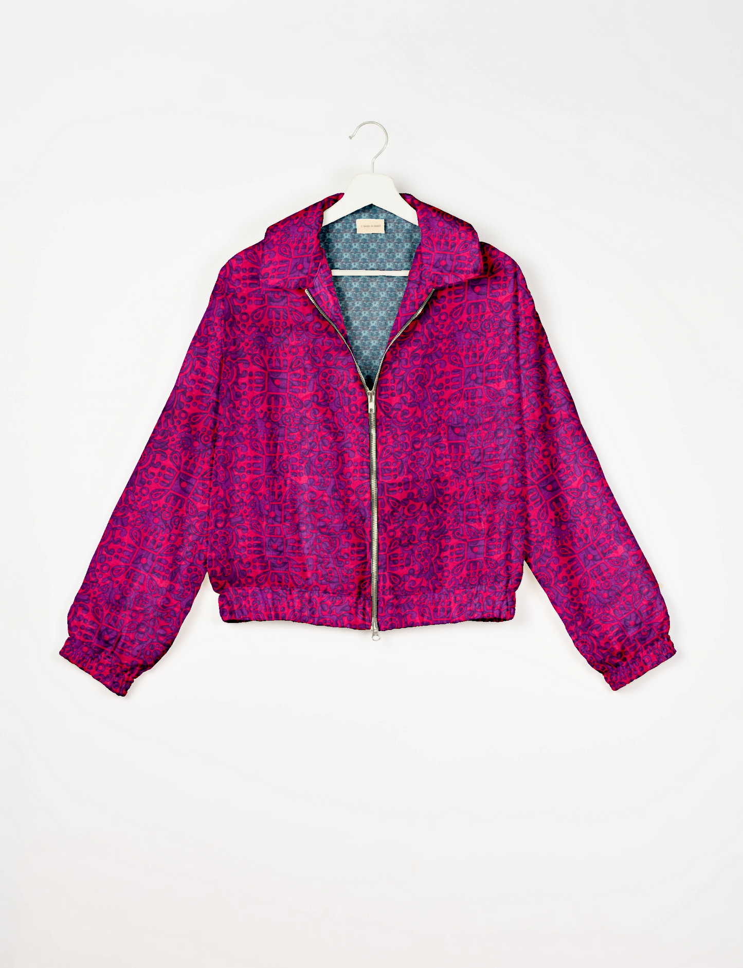 Stylish BOMBER JACKET, an upcycled clothing masterpiece with a cute cropped shape, elasticated details, and detachable metallic zipper. Contrast sari print lining adds a unique touch. Explore sustainable and eco-friendly fashion.