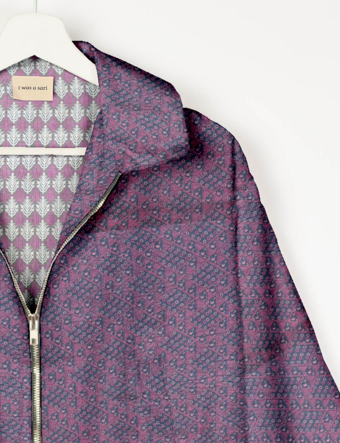 Upcycled Bomber Jacket made from recycled sari materials, featuring a cute cropped shape, elasticated hem and cuffs, and contrast sari print lining. Sustainable apparel promoting eco-friendly fashion and ethical clothing.