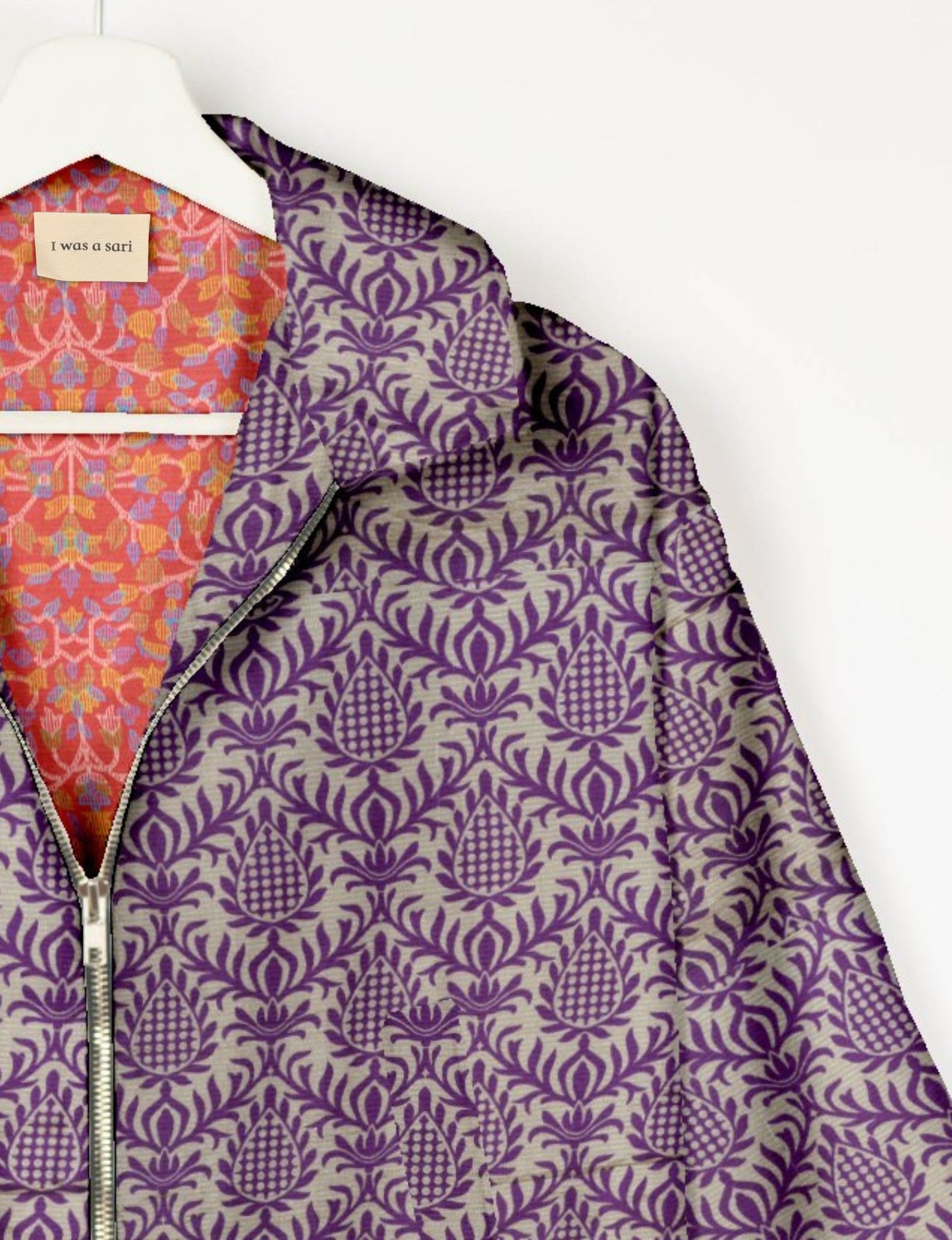 Upcycled Bomber Jacket made from recycled sari materials, featuring a cute cropped shape, elasticated hem and cuffs, and contrast sari print lining. Sustainable apparel promoting eco-friendly fashion and ethical clothing.