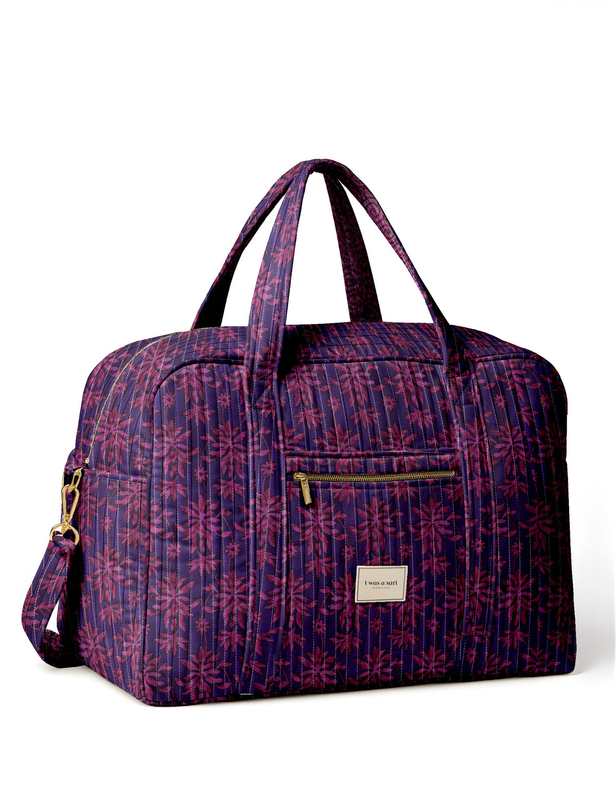 Quilted duffle bag with purple and pink leaf pattern, front zipper pocket, dual handles, and detachable shoulder strap