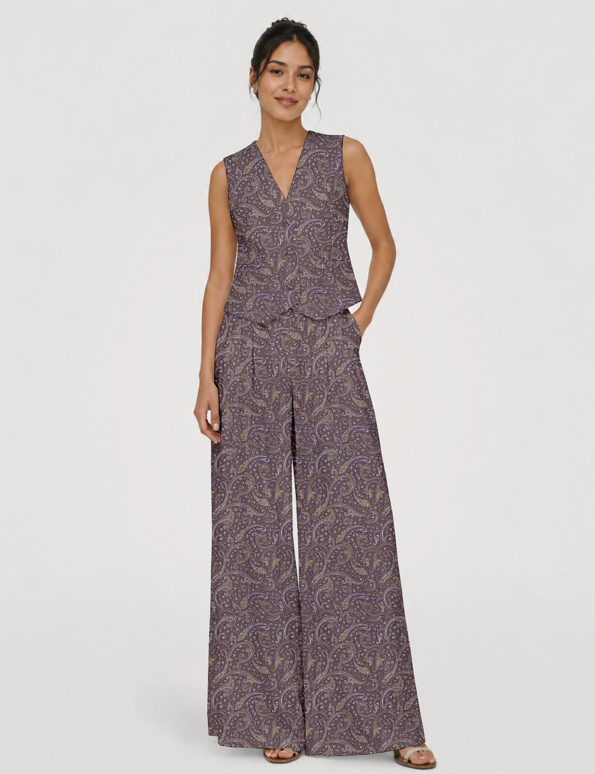 Women's tailored waistcoat set with a sleeveless V-neck button-front waistcoat and high-rise wide leg trousers in a coordinated matching outfit.