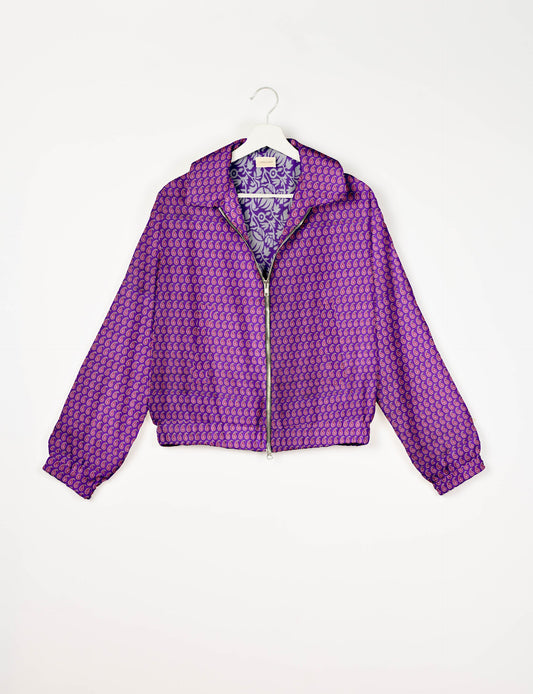 Upcycled Bomber Jacket made from recycled sari materials, featuring a cute cropped shape, elasticated hem and cuffs, and contrast sari print lining. Sustainable apparel promoting eco-friendly fashion and ethical clothing.