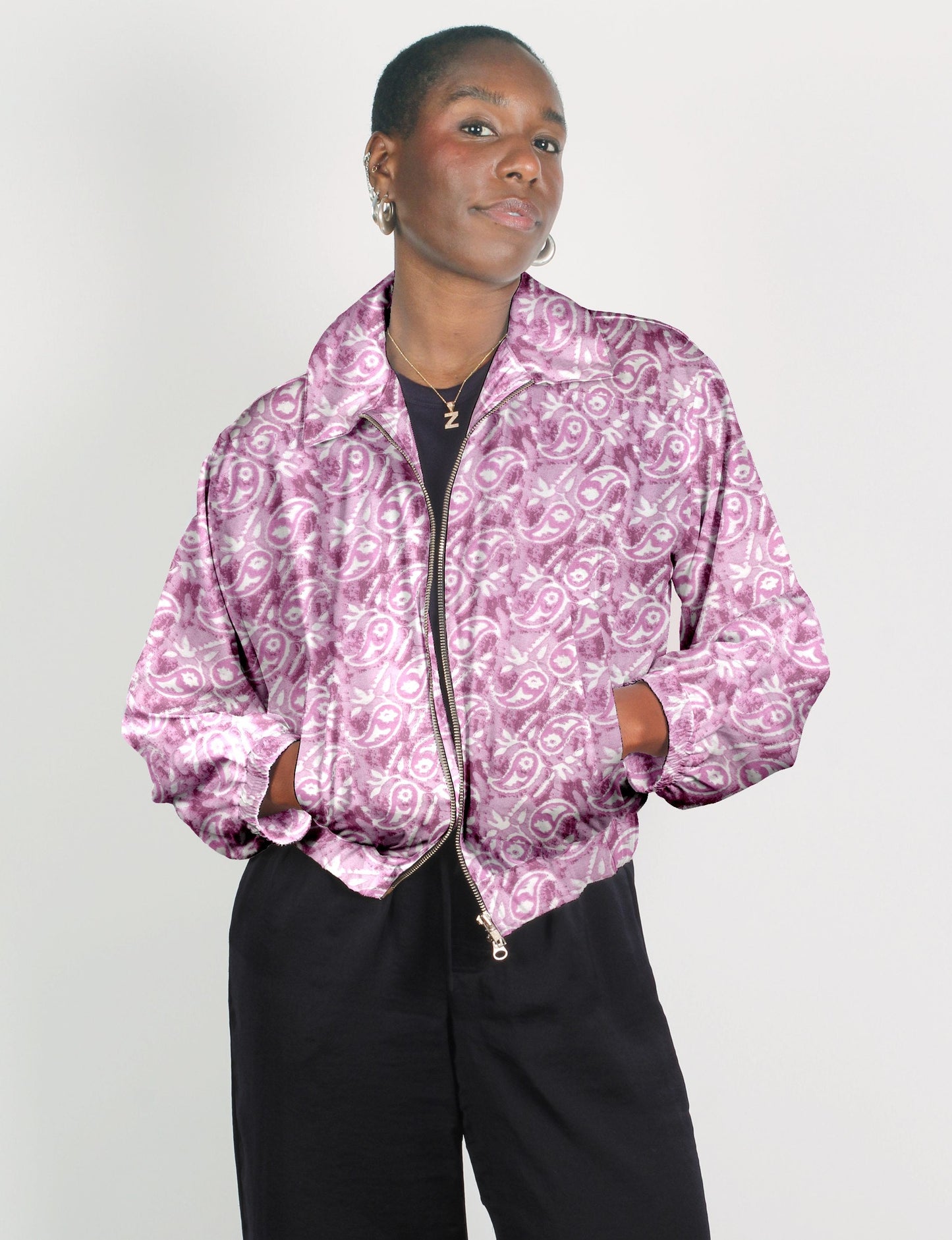 Upcycled Bomber Jacket made from recycled sari materials, featuring a cute cropped shape, elasticated hem and cuffs, and contrast sari print lining. Sustainable apparel promoting eco-friendly fashion and ethical clothing.