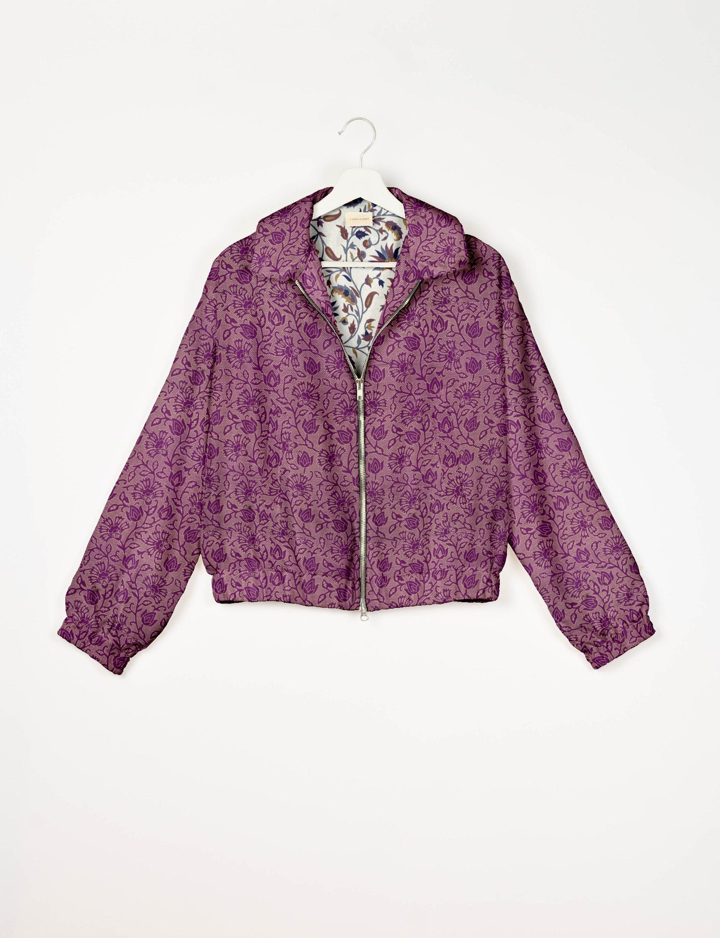 Upcycled Bomber Jacket made from recycled sari materials, featuring a cute cropped shape, elasticated hem and cuffs, and contrast sari print lining. Sustainable apparel promoting eco-friendly fashion and ethical clothing.
