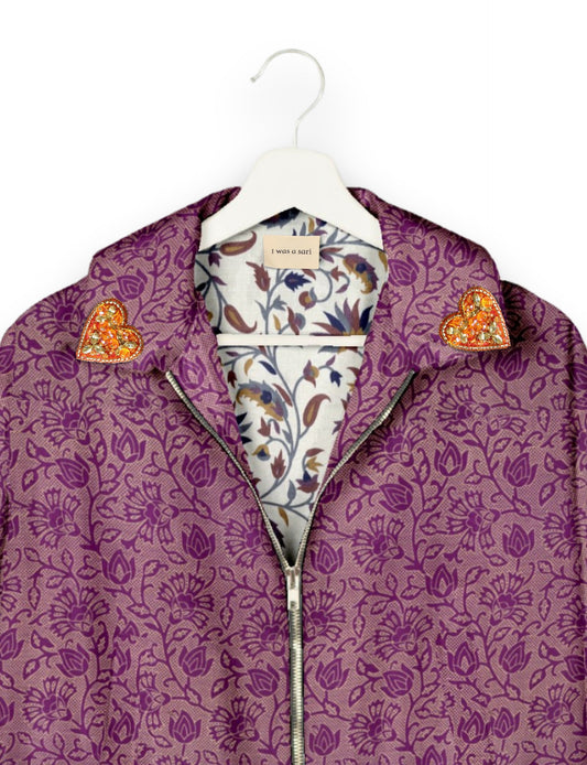 Make a bold statement with our Heart Drop Earrings, a symbol of conscious luxury and ethical fashion. Handcrafted using the intricate Aari embroidery technique, these earrings are made from upcycled sari fabric, embracing slow fashion and zero waste clothing. Elevate your look with sustainable apparel that supports fair trade fashion while reducing textile waste. Choose eco-friendly fashion that speaks of love, artistry, and responsibility.