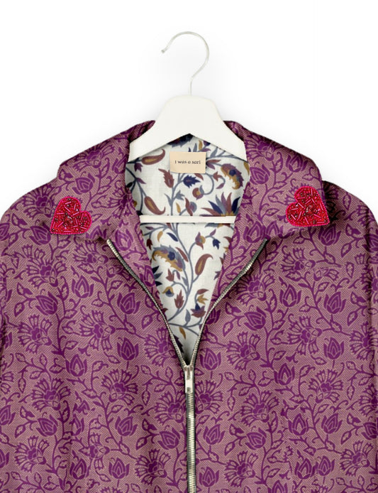 Make a bold statement with our Heart Drop Earrings, a symbol of conscious luxury and ethical fashion. Handcrafted using the intricate Aari embroidery technique, these earrings are made from upcycled sari fabric, embracing slow fashion and zero waste clothing. Elevate your look with sustainable apparel that supports fair trade fashion while reducing textile waste. Choose eco-friendly fashion that speaks of love, artistry, and responsibility.