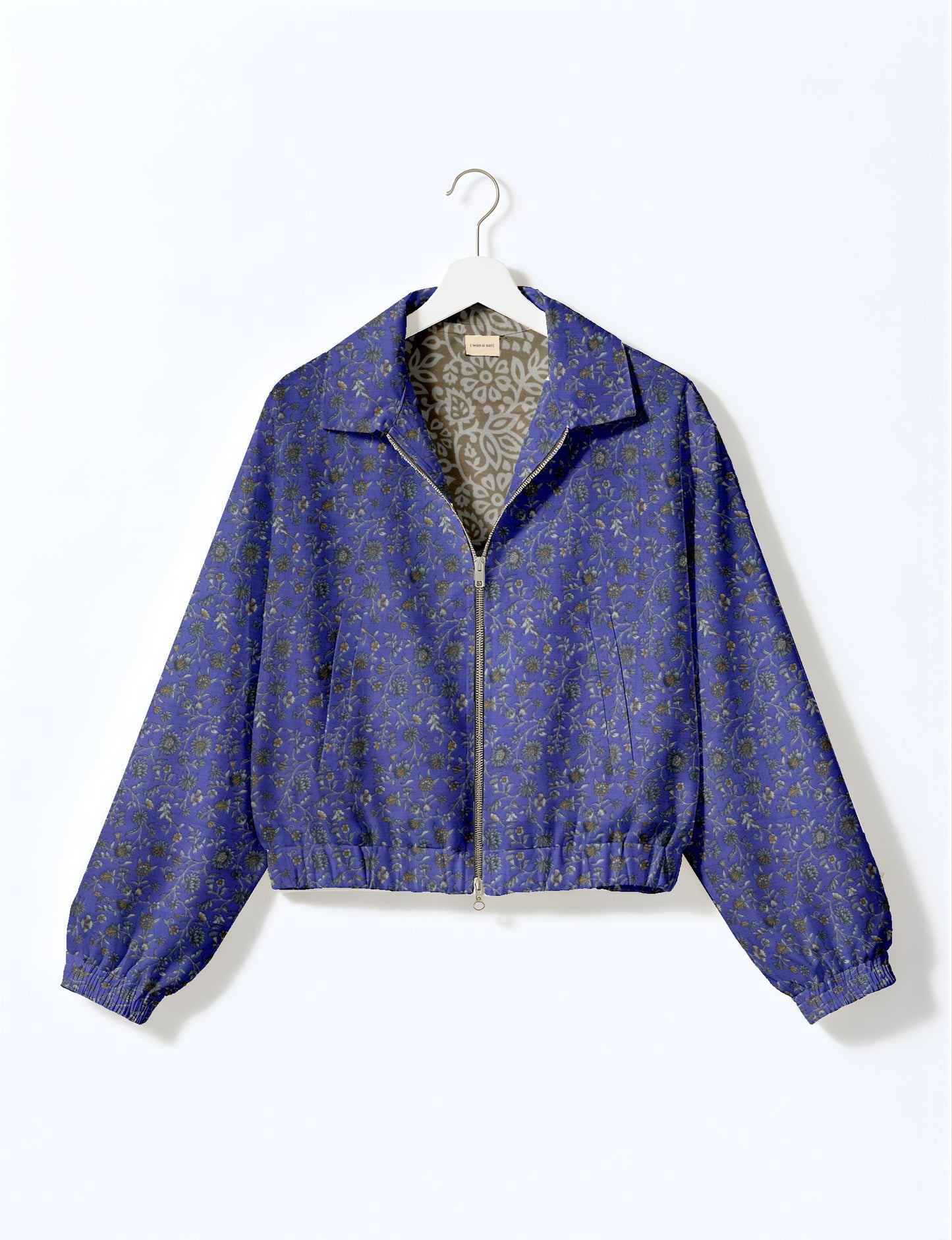 Upcycled Bomber Jacket made from recycled sari materials, featuring a cute cropped shape, elasticated hem and cuffs, and contrast sari print lining. Sustainable apparel promoting eco-friendly fashion and ethical clothing.