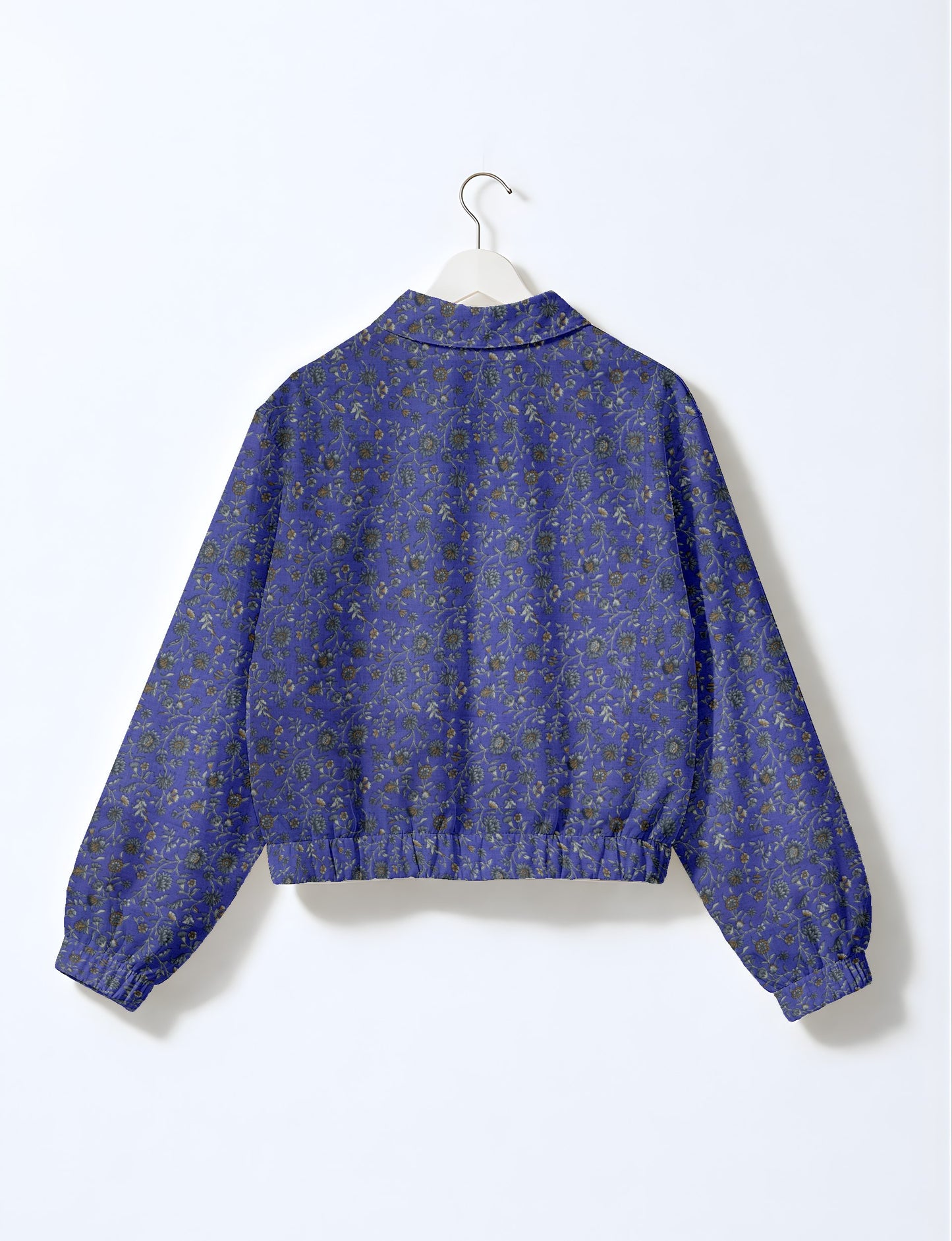 Upcycled Bomber Jacket made from recycled sari materials, featuring a cute cropped shape, elasticated hem and cuffs, and contrast sari print lining. Sustainable apparel promoting eco-friendly fashion and ethical clothing.