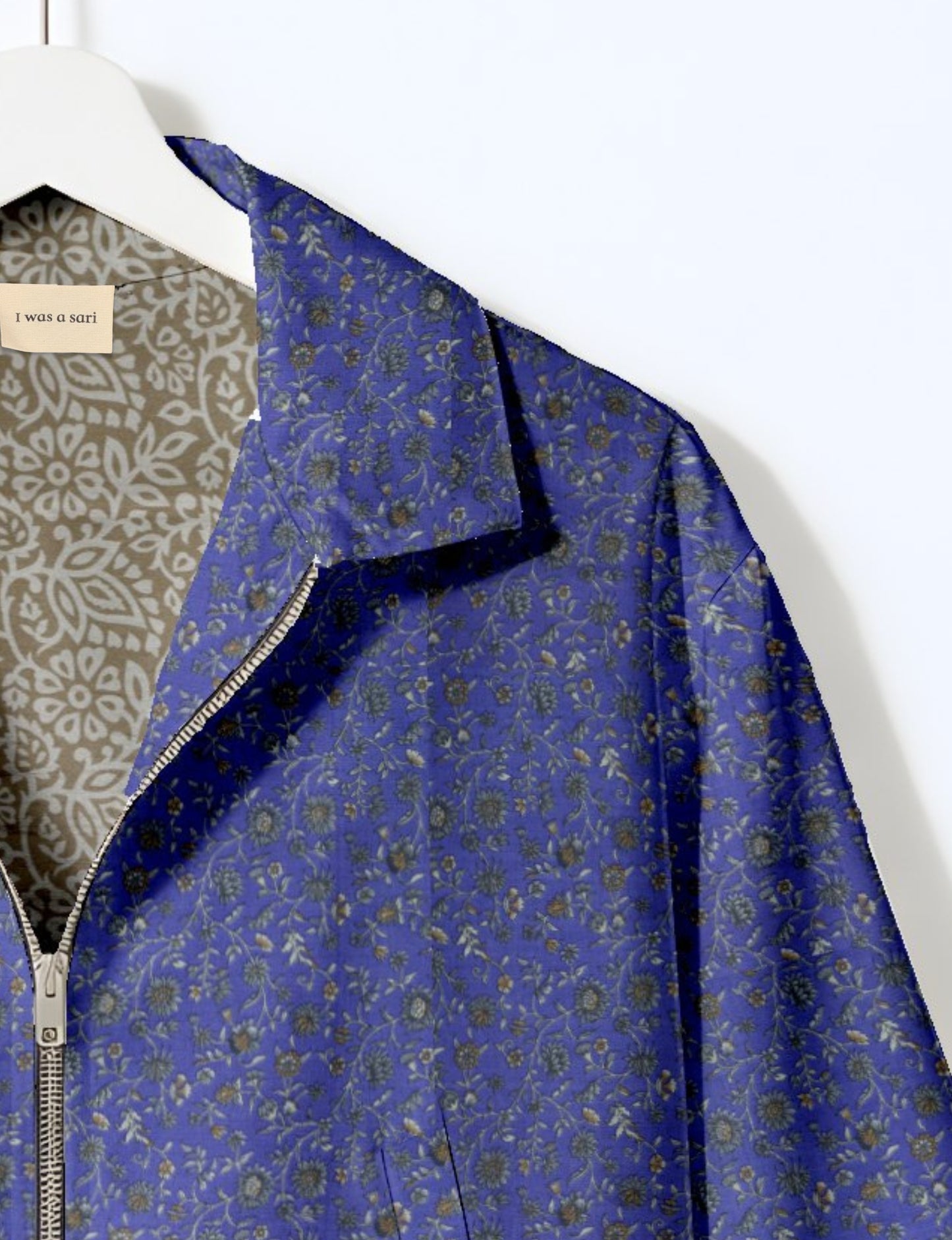 Upcycled Bomber Jacket made from recycled sari materials, featuring a cute cropped shape, elasticated hem and cuffs, and contrast sari print lining. Sustainable apparel promoting eco-friendly fashion and ethical clothing.