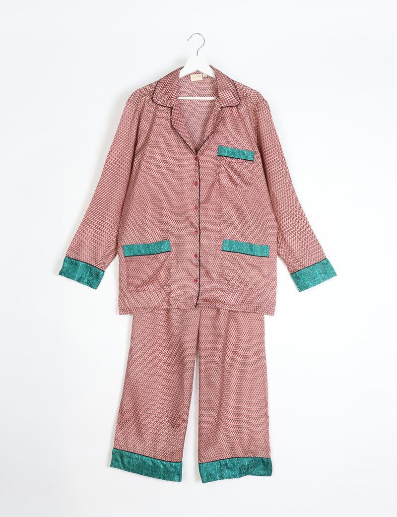 Beige long-sleeve pajama set with red micro pattern and teal paisley trim on cuffs and pockets, hanging flat front view