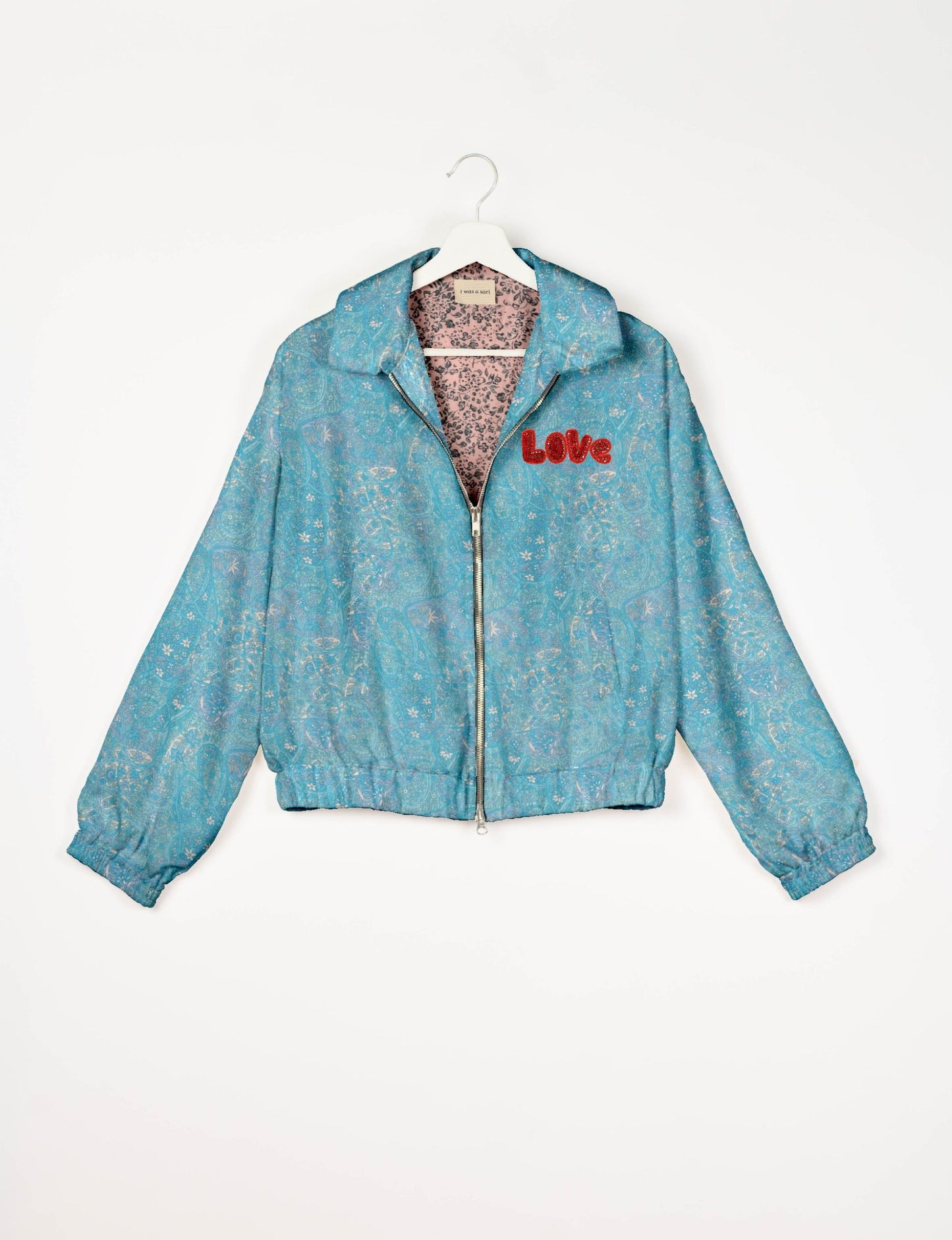 Love Bomber Jacket made from recycled fabric, featuring hand-stitched Aari embroidery. A unique piece of zero-waste clothing, part of the circular fashion movement. Designed with upcycled materials for a stylish yet environmentally friendly clothing choice.