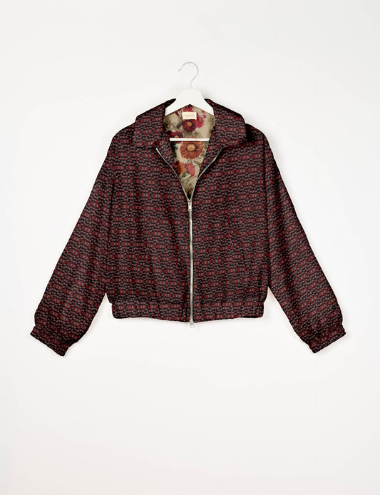 Upcycled Bomber Jacket made from recycled sari materials, featuring a cute cropped shape, elasticated hem and cuffs, and contrast sari print lining. Sustainable apparel promoting eco-friendly fashion and ethical clothing.