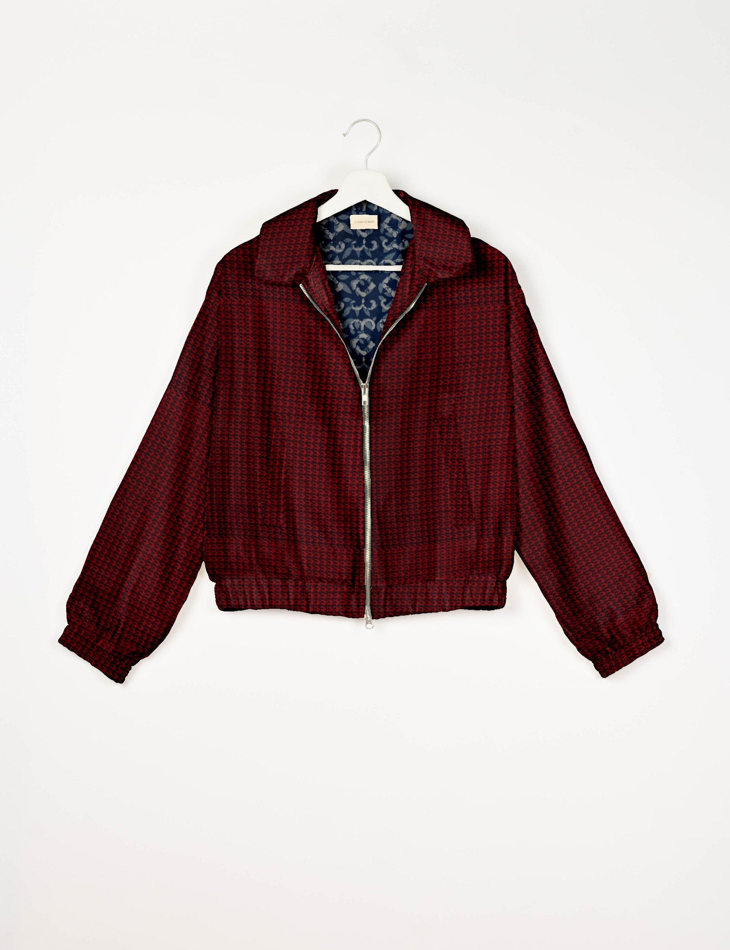 Upcycled Bomber Jacket made from recycled sari materials, featuring a cute cropped shape, elasticated hem and cuffs, and contrast sari print lining. Sustainable apparel promoting eco-friendly fashion and ethical clothing.