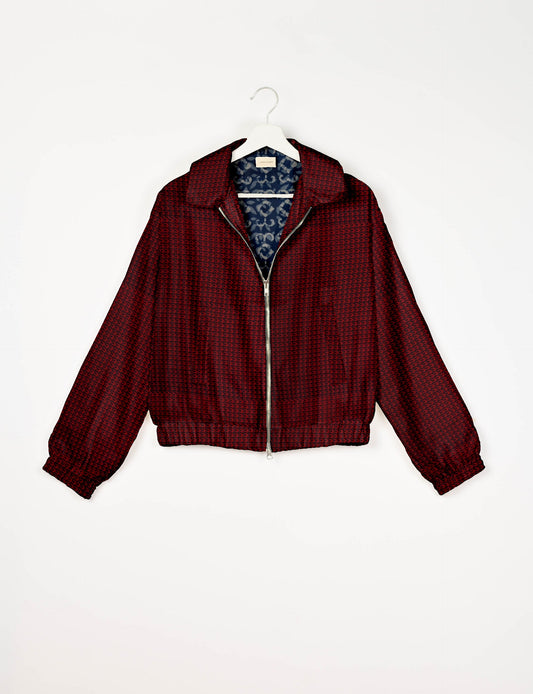 Upcycled Bomber Jacket made from recycled sari materials, featuring a cute cropped shape, elasticated hem and cuffs, and contrast sari print lining. Sustainable apparel promoting eco-friendly fashion and ethical clothing.