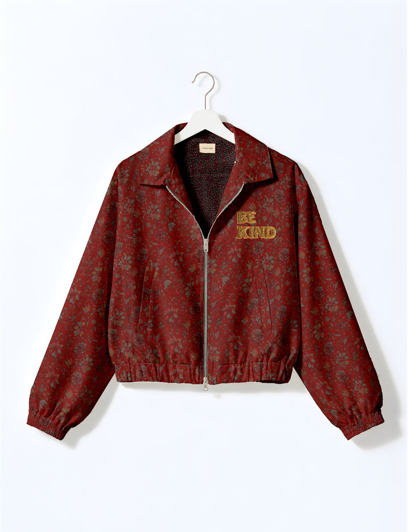BE KIND Bomber jacket made from upcycled sari fabric with handcrafted Aari embroidery by female artisans.