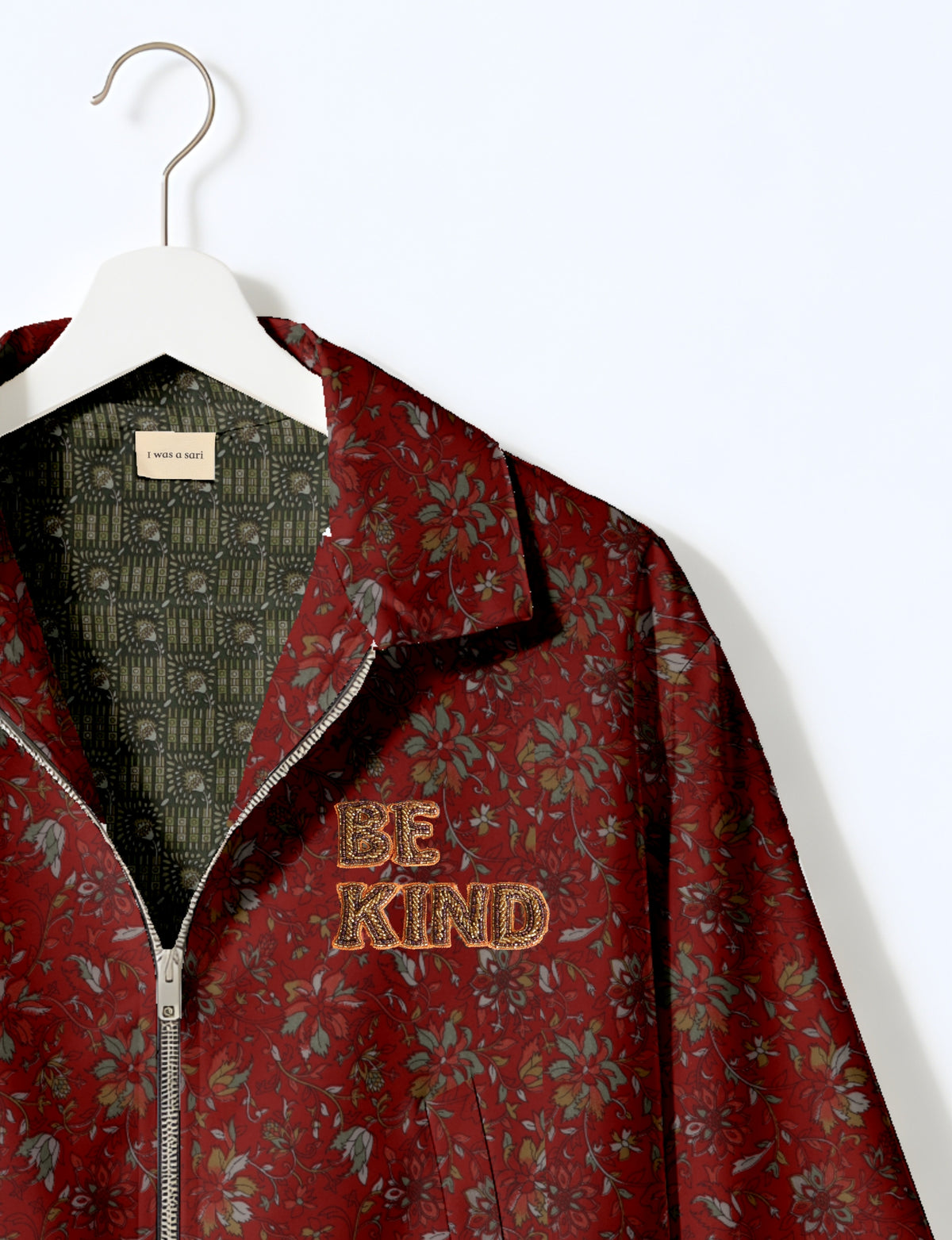 BE KIND Bomber jacket made from upcycled sari fabric with handcrafted Aari embroidery by female artisans.