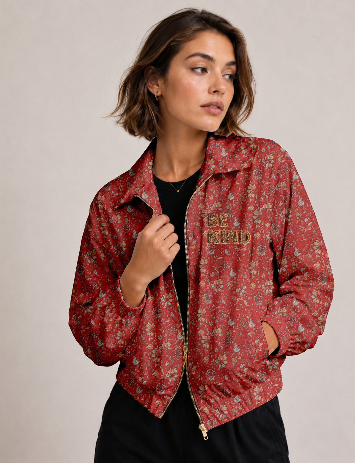 BE KIND Bomber jacket made from upcycled sari fabric with handcrafted Aari embroidery by female artisans.