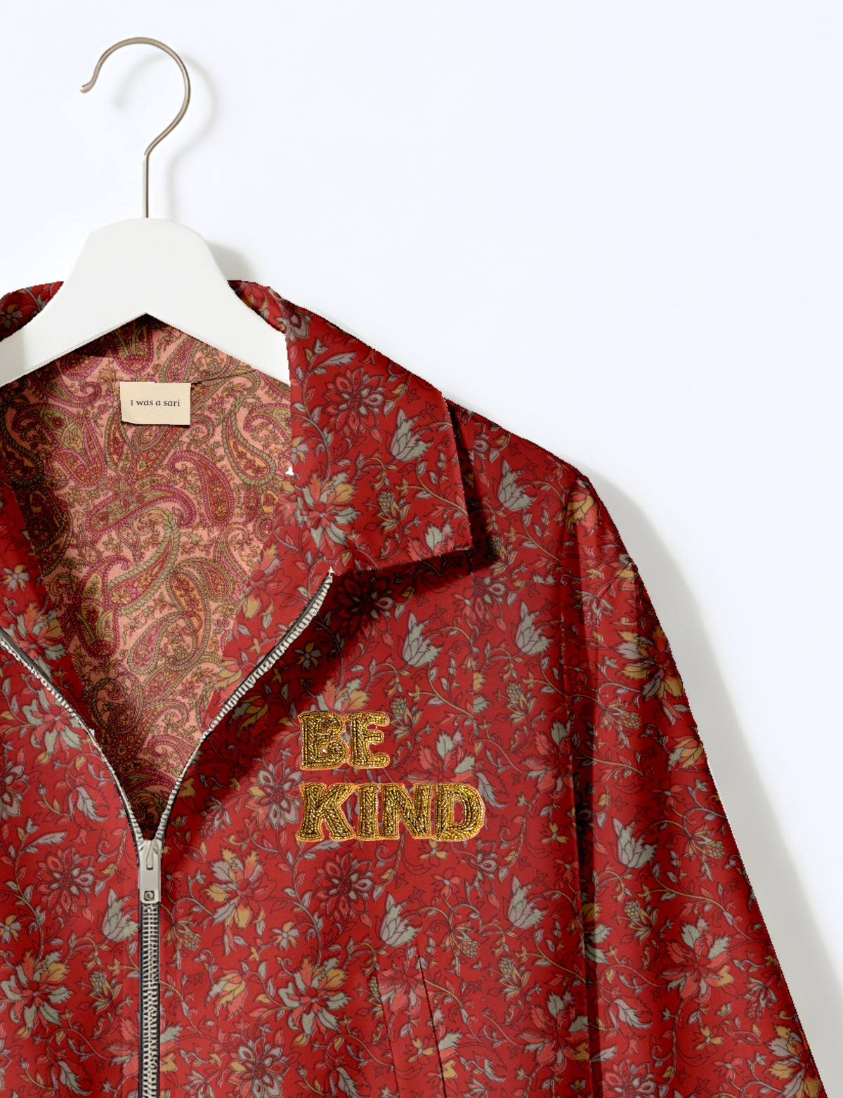 BE KIND Bomber jacket made from upcycled sari fabric with handcrafted Aari embroidery by female artisans.