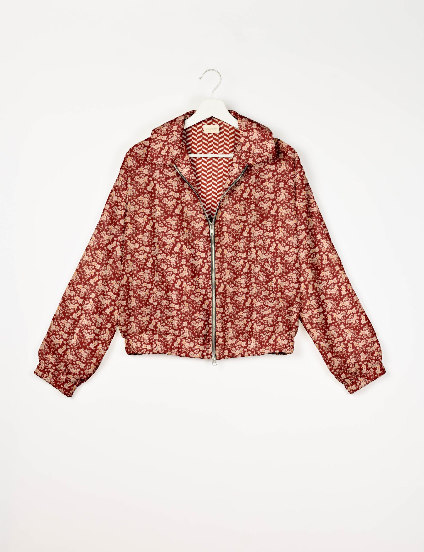 Upcycled Bomber Jacket made from recycled sari materials, featuring a cute cropped shape, elasticated hem and cuffs, and contrast sari print lining. Sustainable apparel promoting eco-friendly fashion and ethical clothing.