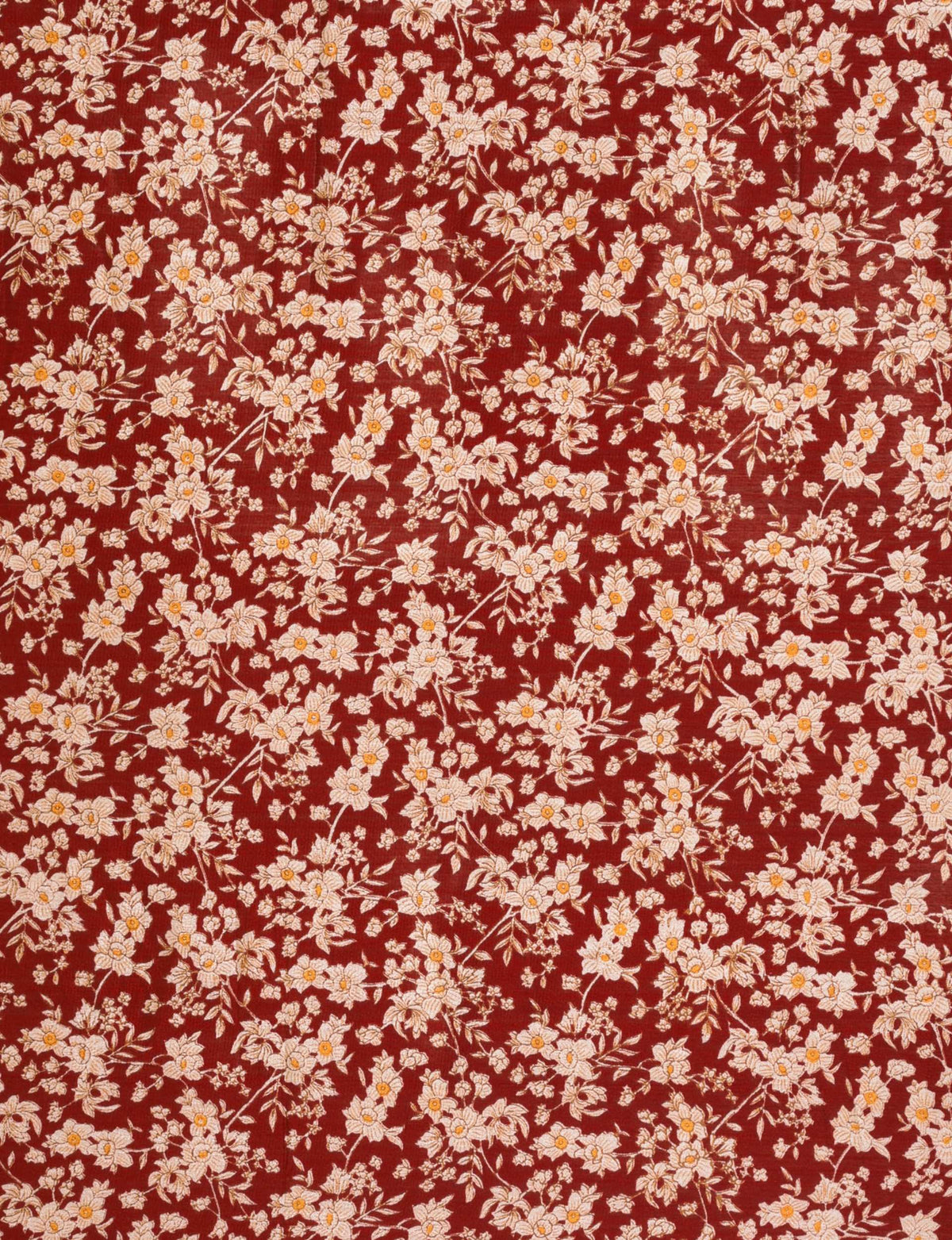 Red fabric with dense white and light pink floral print featuring small yellow centers and green leaves