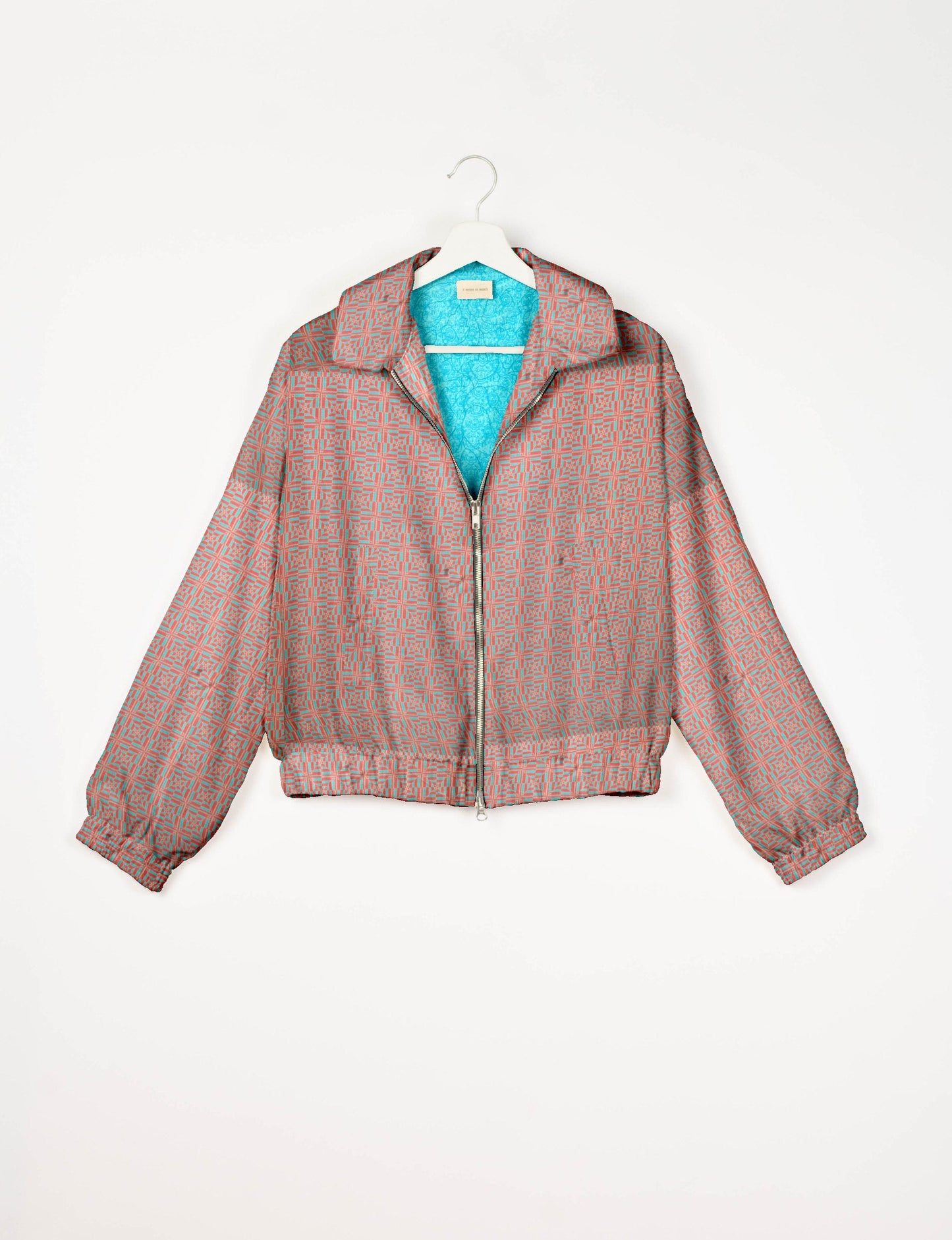 Upcycled Bomber Jacket made from recycled sari materials, featuring a cute cropped shape, elasticated hem and cuffs, and contrast sari print lining. Sustainable apparel promoting eco-friendly fashion and ethical clothing.