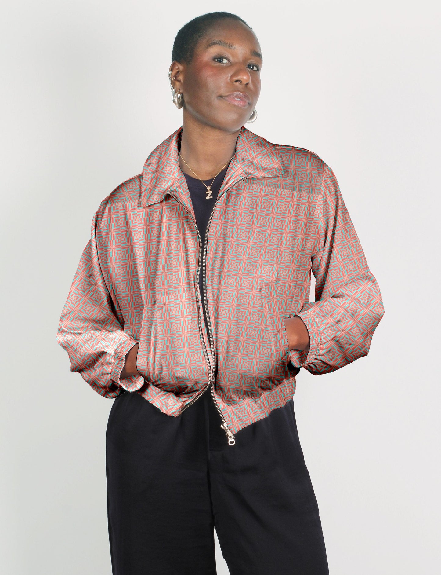 Upcycled Bomber Jacket made from recycled sari materials, featuring a cute cropped shape, elasticated hem and cuffs, and contrast sari print lining. Sustainable apparel promoting eco-friendly fashion and ethical clothing.