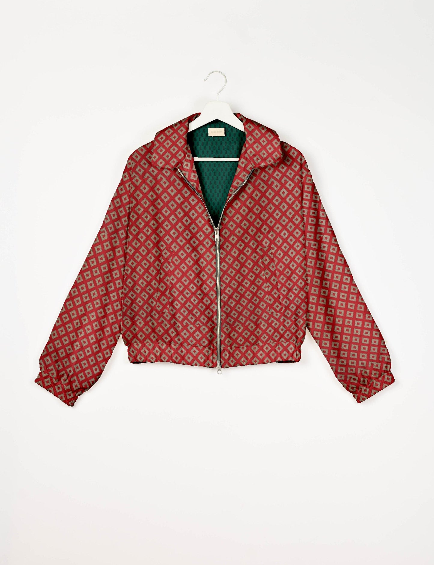 Upcycled Bomber Jacket made from recycled sari materials, featuring a cute cropped shape, elasticated hem and cuffs, and contrast sari print lining. Sustainable apparel promoting eco-friendly fashion and ethical clothing.